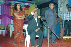 Mr. KK Gupta addressing parents of Gyan Vikash Hindi Vidyalaya Surat Mrs. Yamini Upadhyay Director escorting Mr. Gupta to the Dias